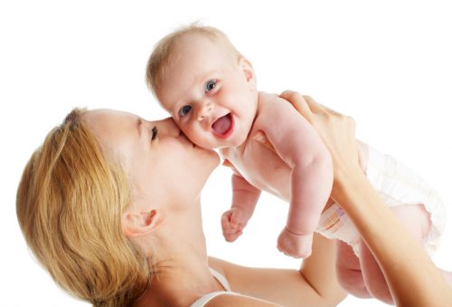 Mother with baby isolated on white